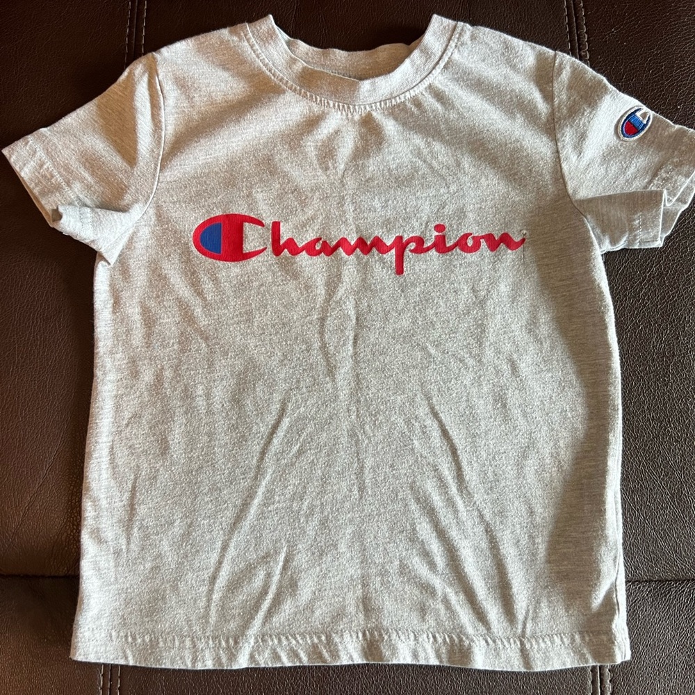 Size 4 toddler Champion shirt, in used condition. Still lots of life left.